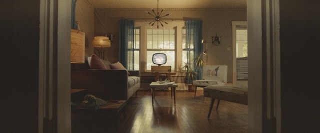 Warm mid-century living room with vintage television set