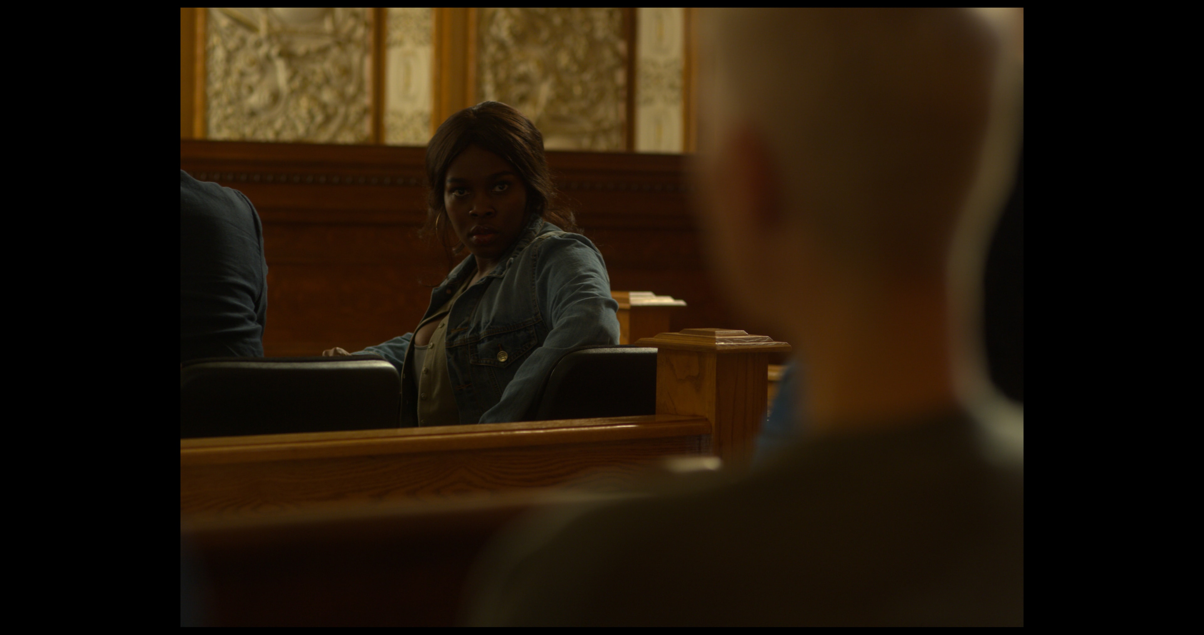 LaKeisha stares at Kiersten in a courtroom scene