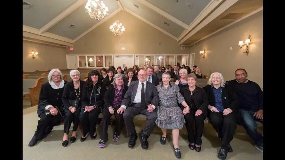 Large group gathered in chapel for a documentary screening