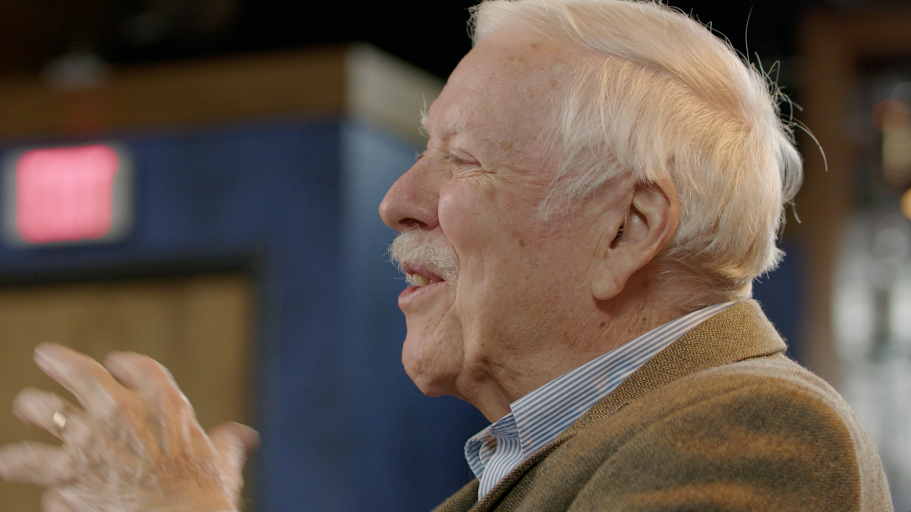 Close-up portrait of elderly man laughing